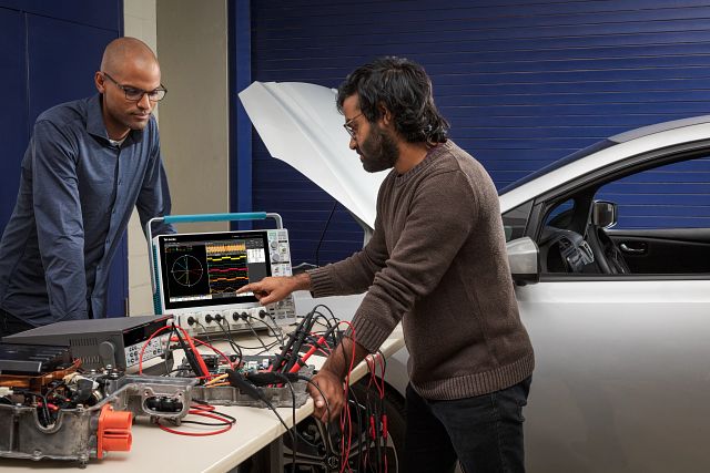 Engineers using a 4 Series B MSO to diagnose an EV powertrain