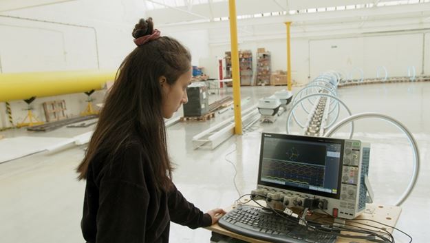 Aanchal Mittal, an engineer at Magway, in the United Kingdom, uses Tektronix solutions to test a carbon-free deliver system.