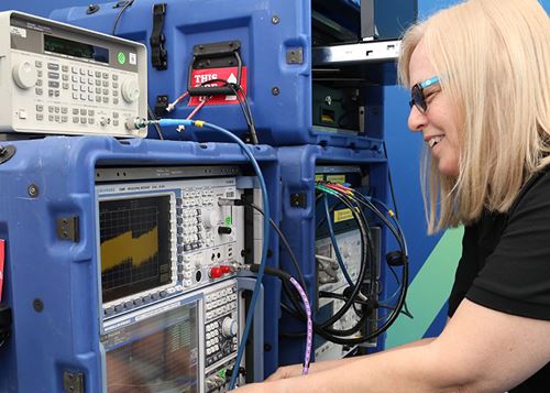 Tektronix calibration service rep working on calibrating a product