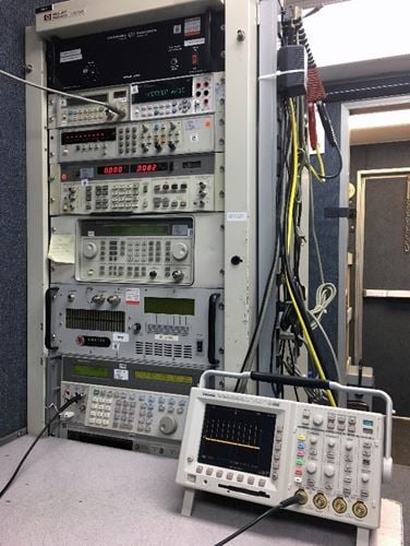 A rack of low-frequency testing equipment inside on of the team’s trucks, including a multi-function calibrator, signal generator, distortion analyzer, multimeter, and frequency counter