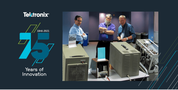 Dave Brown (center) shows vintage Tektronix equipment at the Northwest Electrical Design and Manufacturing Show.