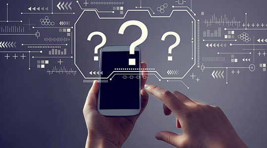 Hands holding a phone with question marks and data graphics indicating the device is being tested
