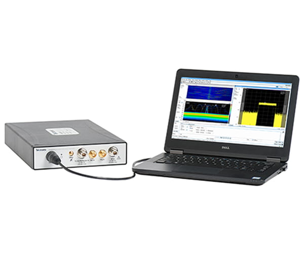 RSA607A Spectrum Analyzer plugged into a tablet PC running SignalVu-PC and displaying a DPX density trigger