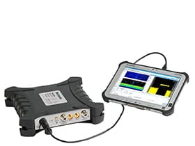 Image of a Tektronix RSA plugged into a tablet showing Signal-Vu software on the screen